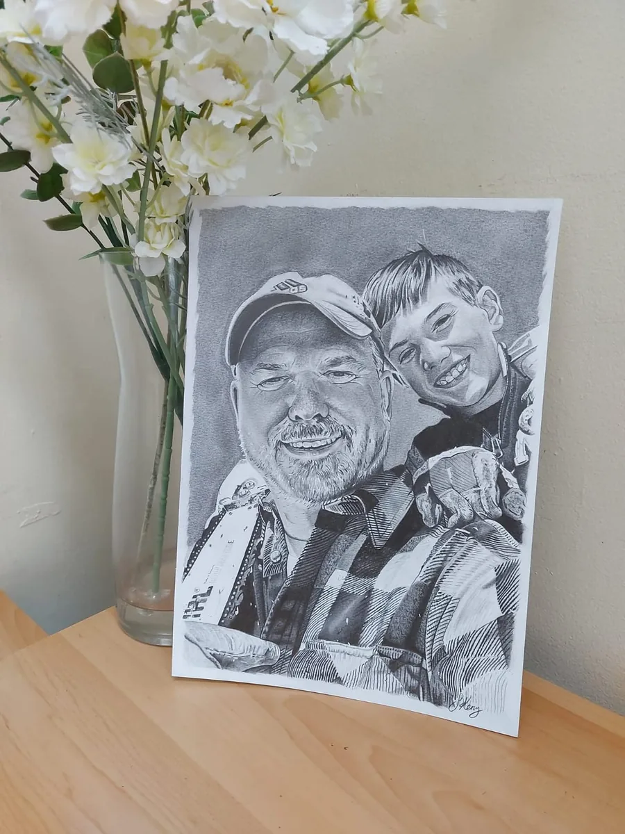 Pencil portrait commission of father and son