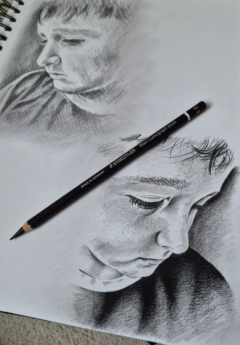 Pencil sketch portrait of a young boy